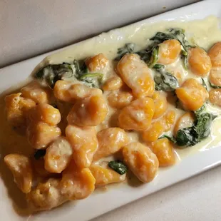 Sweet potato gnocchi with a cream and spinach sauce