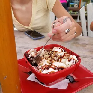 Brownie dessert with coffee and vanilla ice cream.