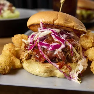 a pulled pork sandwich with coleslaw