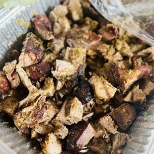 a plastic container filled with meat