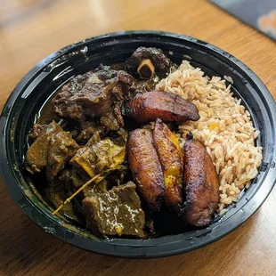 Oxtail and curried goat combo
