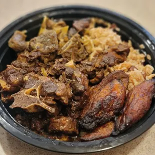 Ox Tail, Curry Goat, fried plantains and rice. Y E S