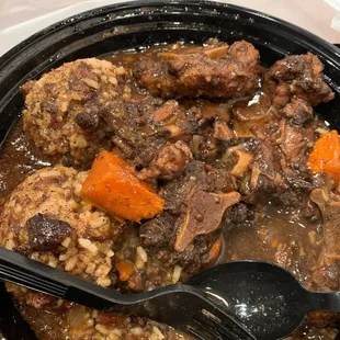 Oxtail with Extra gravy and replace plantains with Rice and Beans