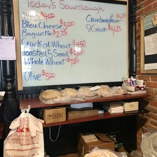 a chalkboard with a price list on it