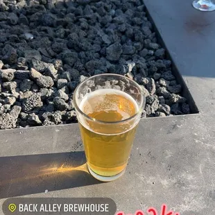 a glass of beer on a table