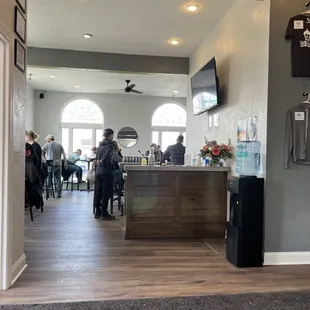 people sitting at tables in a restaurant