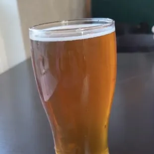 a glass of beer on a table