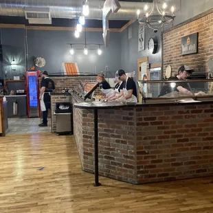 Where pizzas are assembled and cooked.