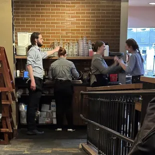 a group of people in a coffee shop