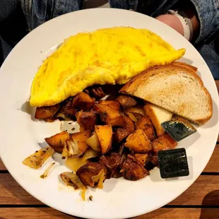 Cheese Omelet with home fries and Sourdough toast