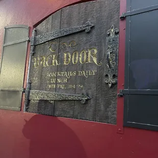 the sign for back door
