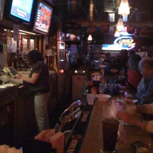 people sitting at the bar