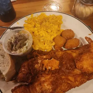 Fish shrimp and scallops mac and cheese and coleslaw