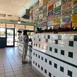 a woman standing at the counter