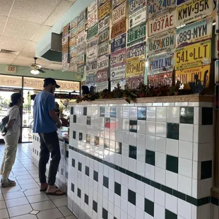 a man and a woman standing in front of a counter