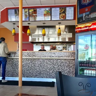 a man standing at the counter