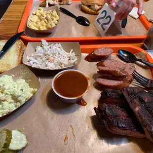 Ribs and jalapeño sausage coleslaw mustard potato salad.