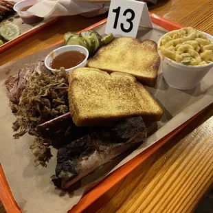 Pulled pork, sliced brisket, and ribs for 3 Meat Combination with 2 Sides OR Fries and Jalapeno Mac and Cheese