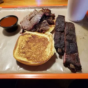 Lean sliced brisket sandwich and couple great ribs