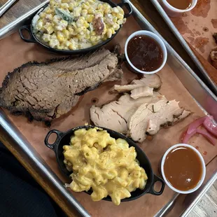 Brisket and smoked turkey with mac and cheese and Mexican street corn