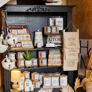a shelf with candles and other items