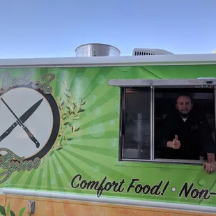 a man in a green food truck
