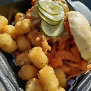 Chicken sandwich with cilantro/thyme aioli and tots