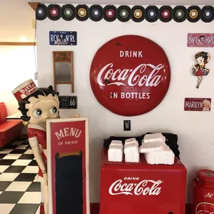 a coca cola machine and a coke machine