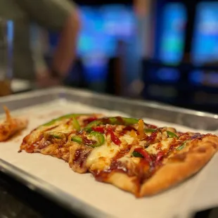 a slice of pizza on a tray