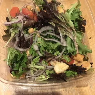 Fresh salad with croutons, tomatoes, garbanzo beans, red onion and dill vinaigrette on the side.