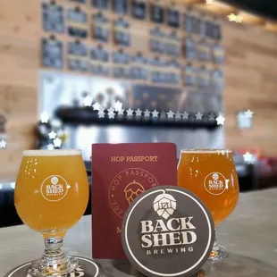 three glasses of beer on a bar