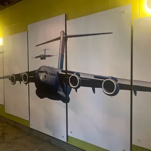 Artwork of a C-17 aircraft in the hallway.