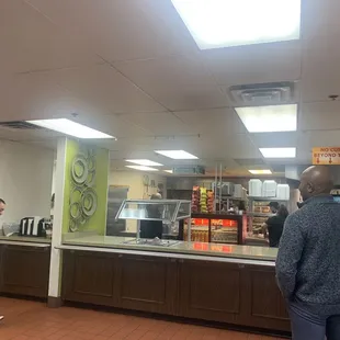 Counter where you wait to pick up the order.