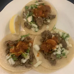Street tacos---carne asada. Meat was tender &amp; tasty but one taco had too much gristle! Taco Tuesday at $3 per taco.