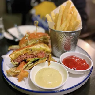 B2B Wagyu Burger w/ sharp cheddar, onion, tomato, shishito aioli, fries | $26