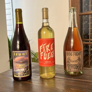 three bottles of wine on a table