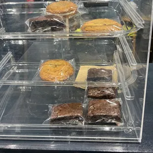 a display case with a variety of baked goods