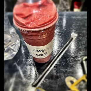 a smoothie in a plastic cup