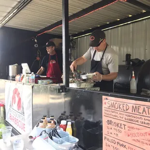 two men preparing food