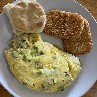 Omelet with hash browns and biscuit.