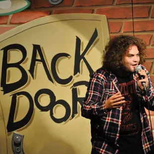 Dustin Ybarra, from TV show Gotham, onstage at Backdoor Comedy