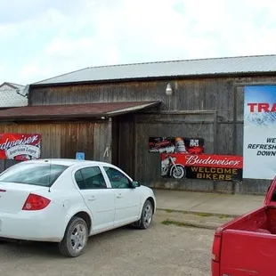 a white car parked in front of a building