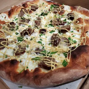 Oktoberfest special, The Wurst pizza: Olive oil base, fresh mozzarella, bratwurst, sauerkraut, Dijon mustard, and parsley.