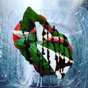 Fresh Tomatoes, Mozzarella, Basil and our housemade Balsamic Vinaigrette. The Caprese.