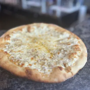 "Create Your Own Pizza" Pizza (Cheese with a Garlic Parmesan base)