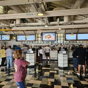 a large group of people standing in line