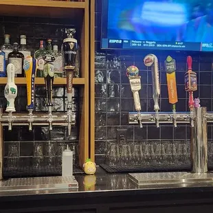 a bar with beer taps
