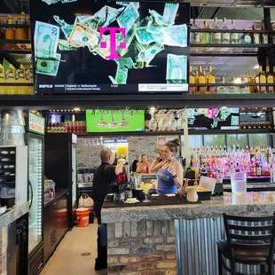 a bar with a large screen