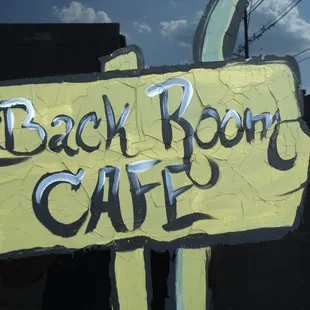 a sign for a beach room cafe