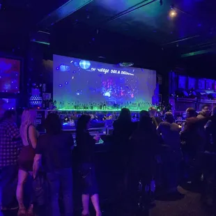 people watching a video game